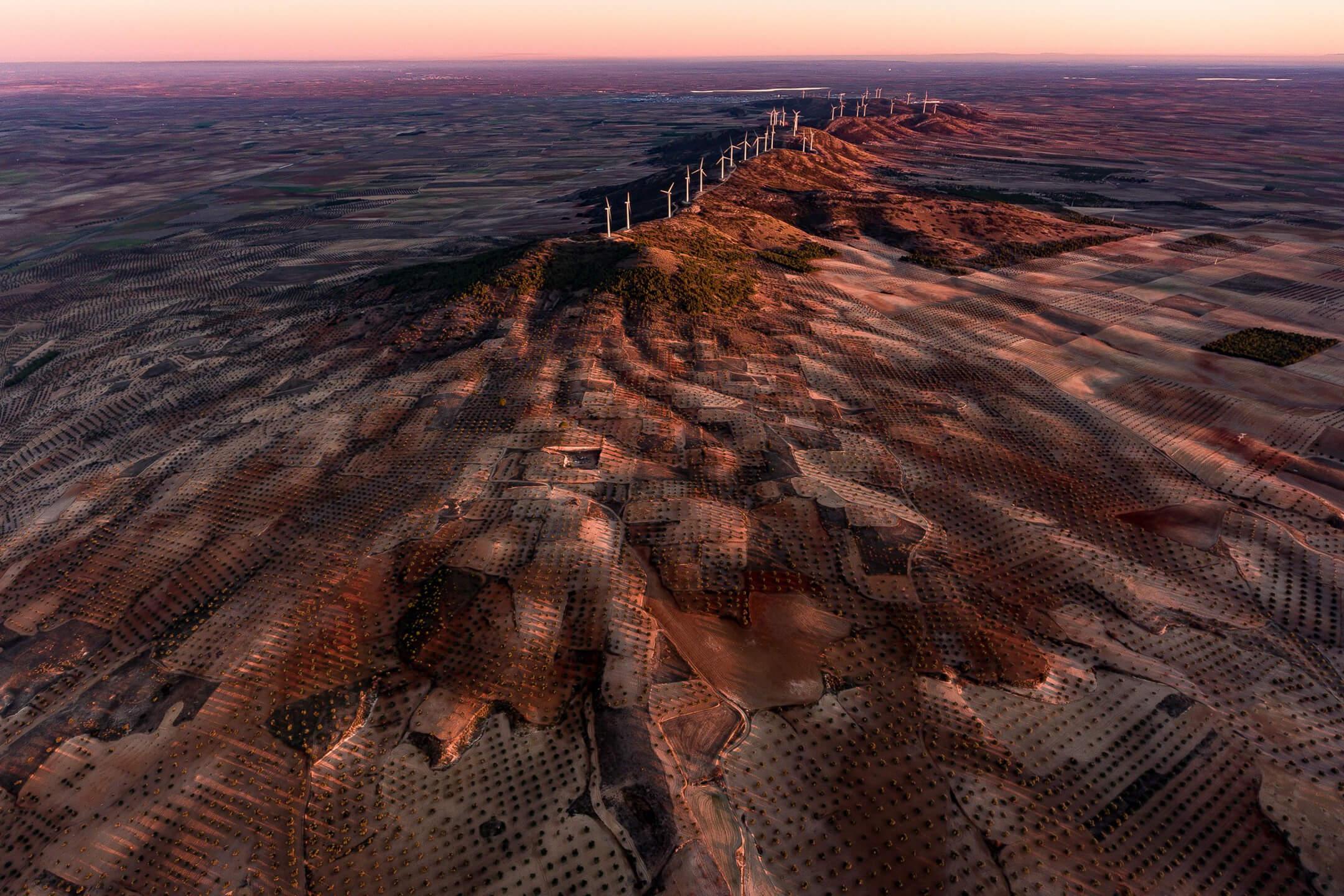 The Villacanas Wind Farm sits atop volcanic Mount El Romeral, taking advantage of the environmental topography.
Photographer: Milan Radisics   Location: Toledo, Spain 
