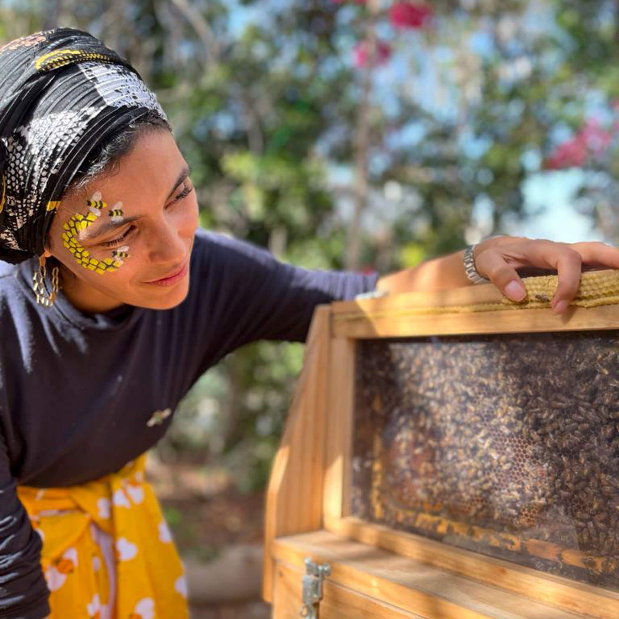 Meriem, aka the Beefairy Lady, checks on a few of the bees, ensuring all are safe and sound. 
Photo: One Hive