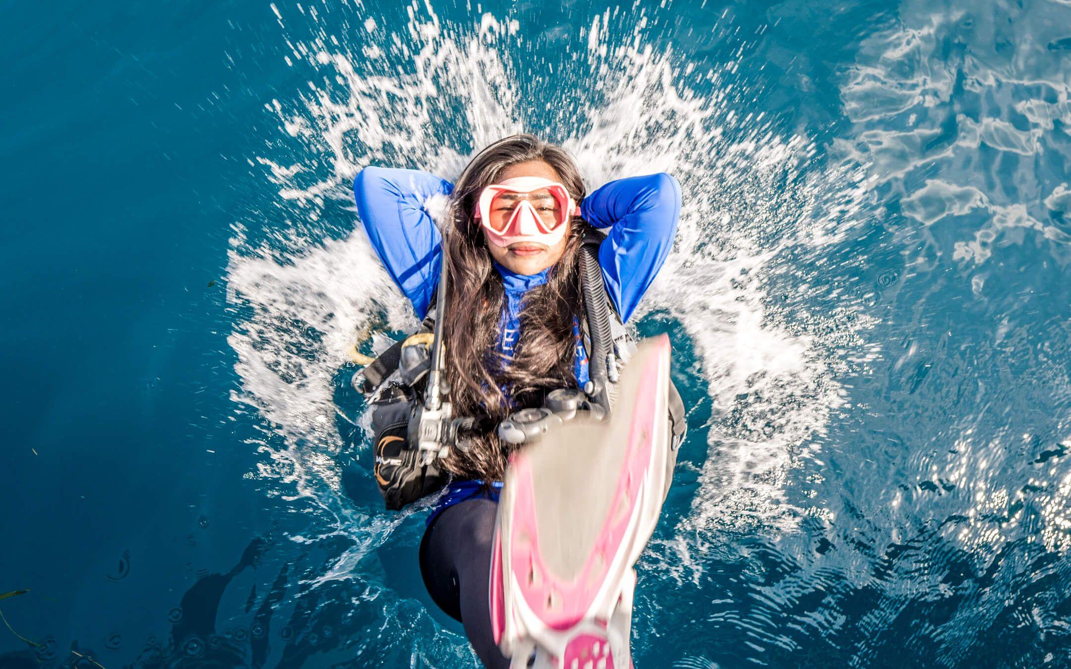 A young diver falls backwards into the ocean.
Photographer: Florian Allgauer