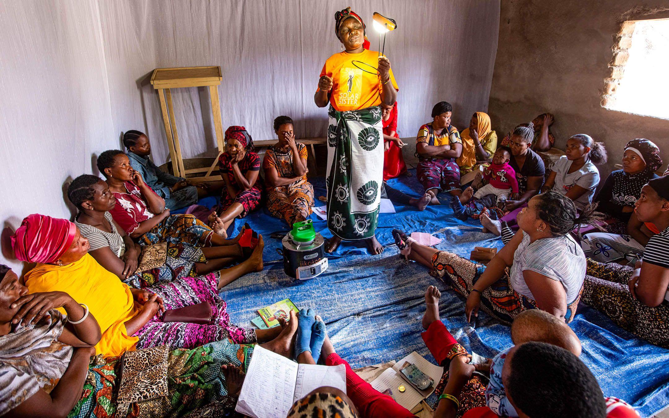 A group of women meet to learn more about Solar Sister’s solar lamps.
Photo: Solar Sisters