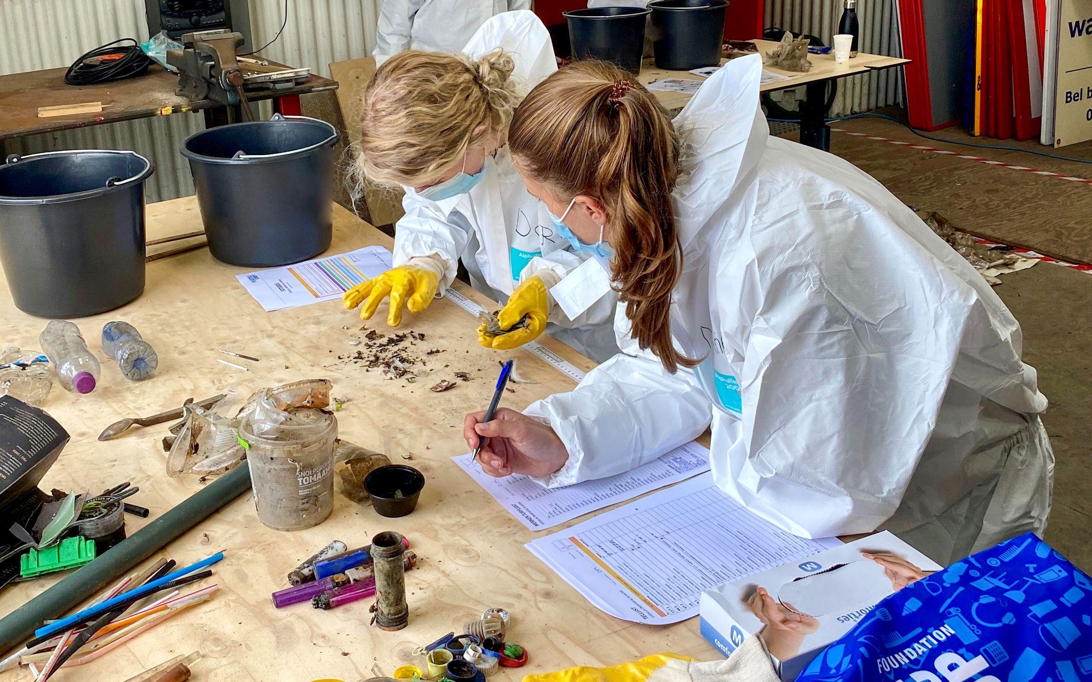 Members of The Great Bubble Barrier team sort plastic after removal from the water.
Photo: The Great Bubble Barrier