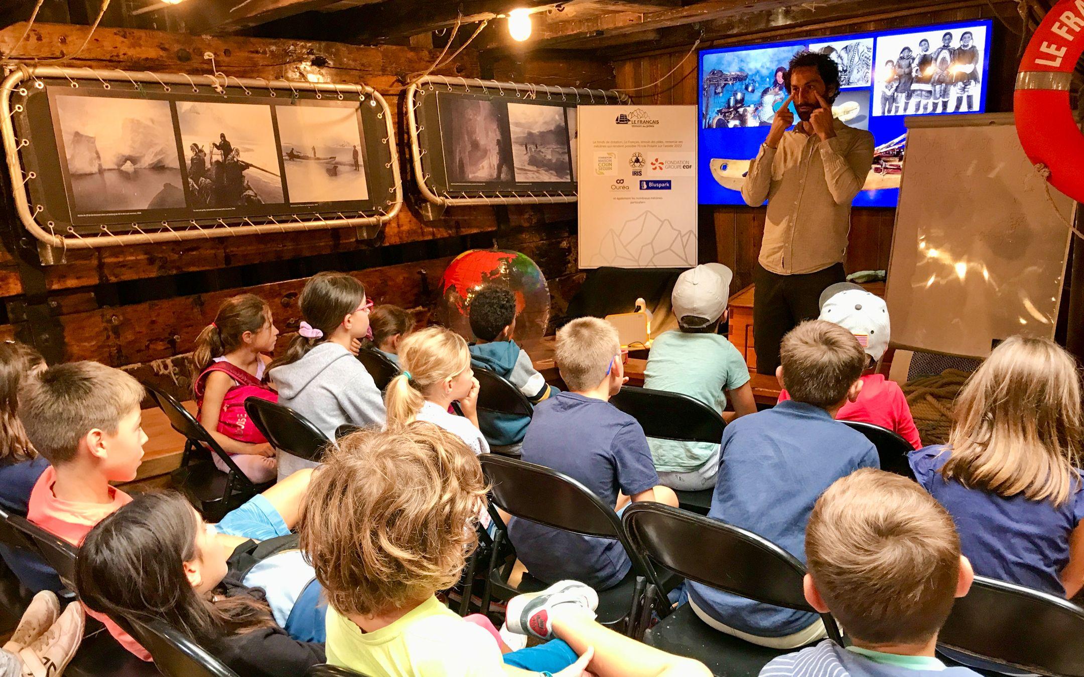 Matthieu during a workshop with primary school; workshops often include a Polar Fresk, a collective exercise to connect the causes of climate warming in polar regions and its consequences, and look together at the solutions.
Photo: l'Ecole des Poles