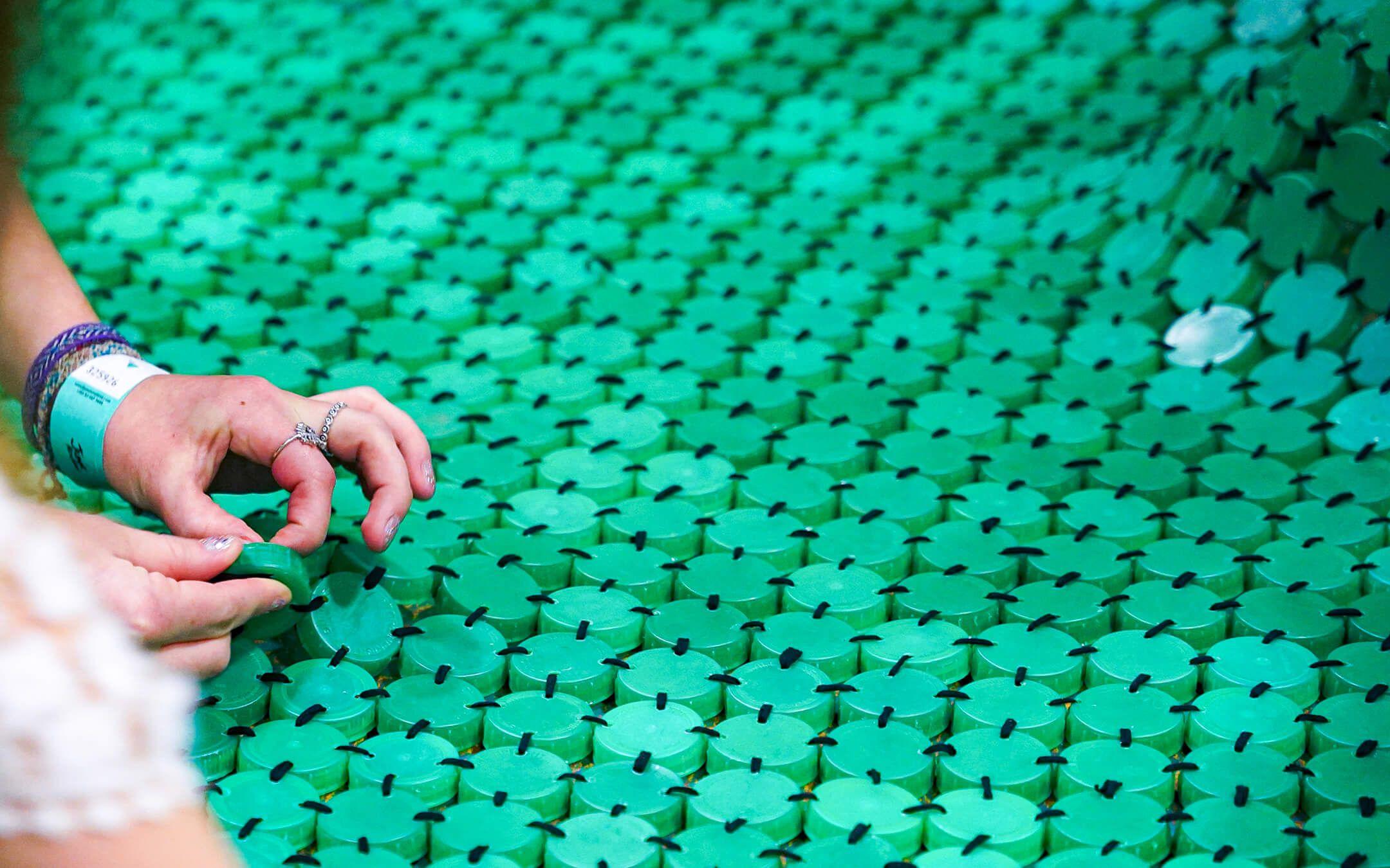 Close-up shot of End of an Era from Marling School, UK, made from 1,323 green bottle caps and 137 clear bottle caps.
Photographer: Stephane Danna