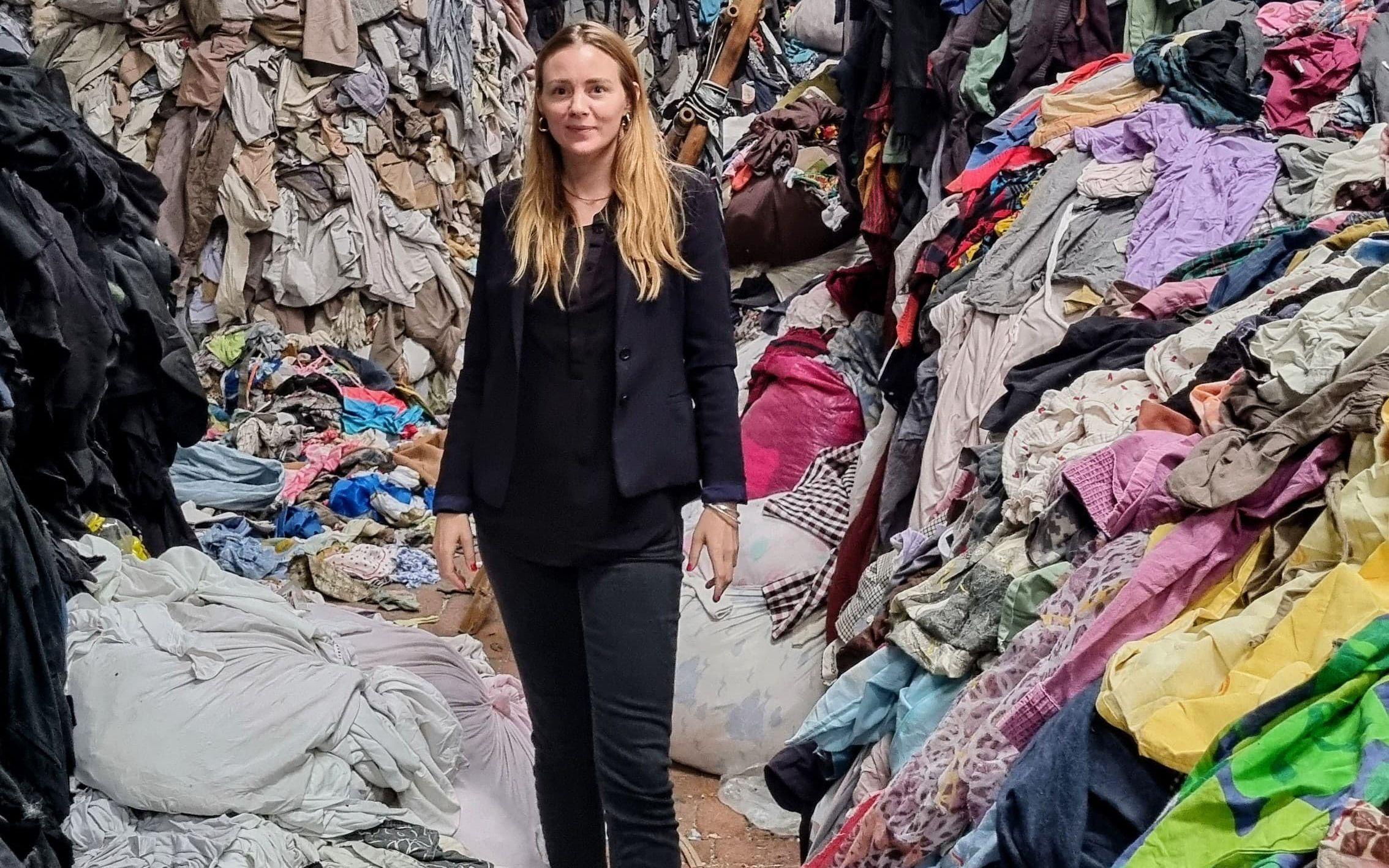 Marina Chahboune, founder of Closed Loop Fashion, stands in the centre of a textile waste storage unit.
Photo: Closed Loop Fashion