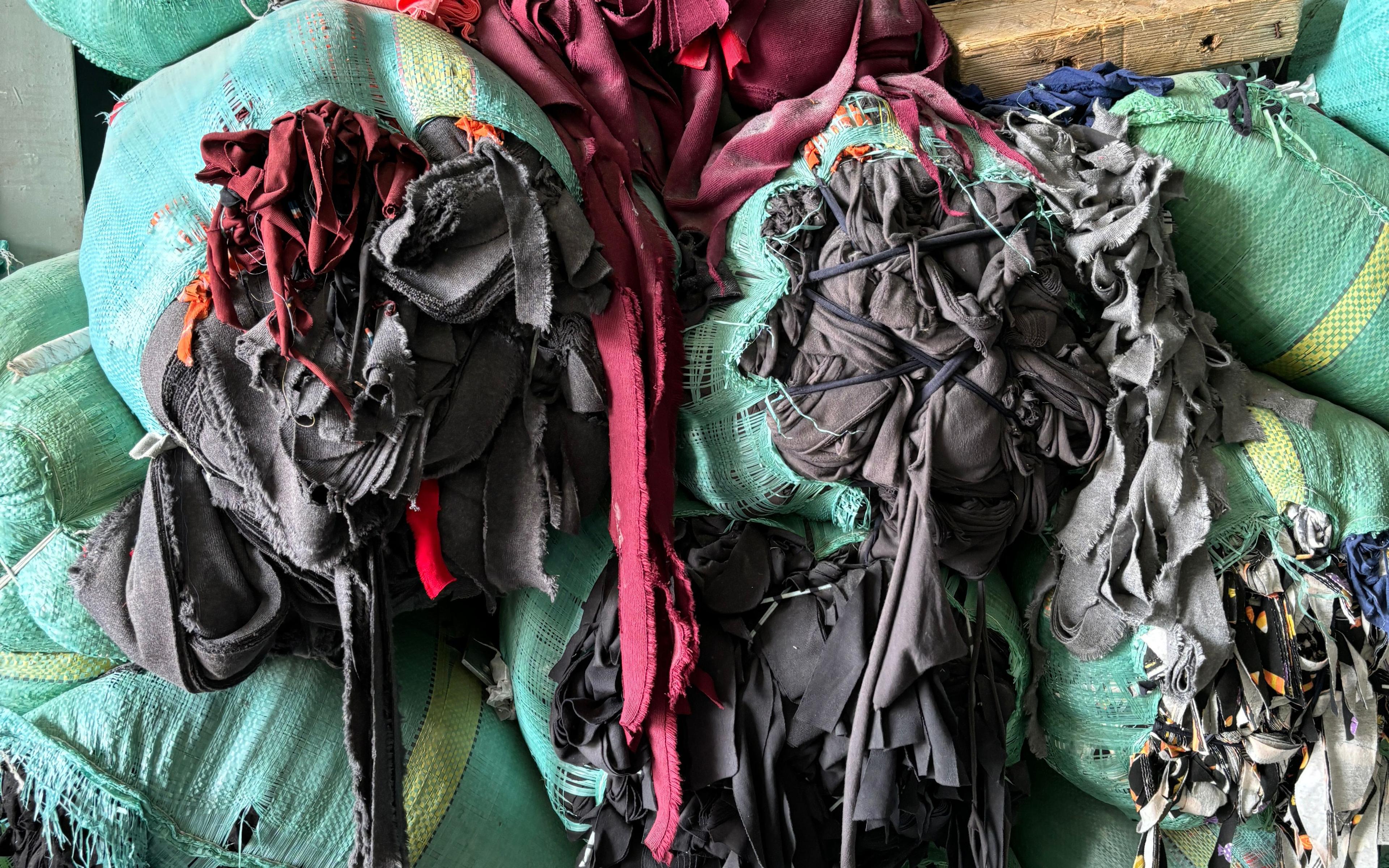 A pile of post-industrial textile waste waits for its next iteration in a factory.
Photo: Closed Loop Fashion