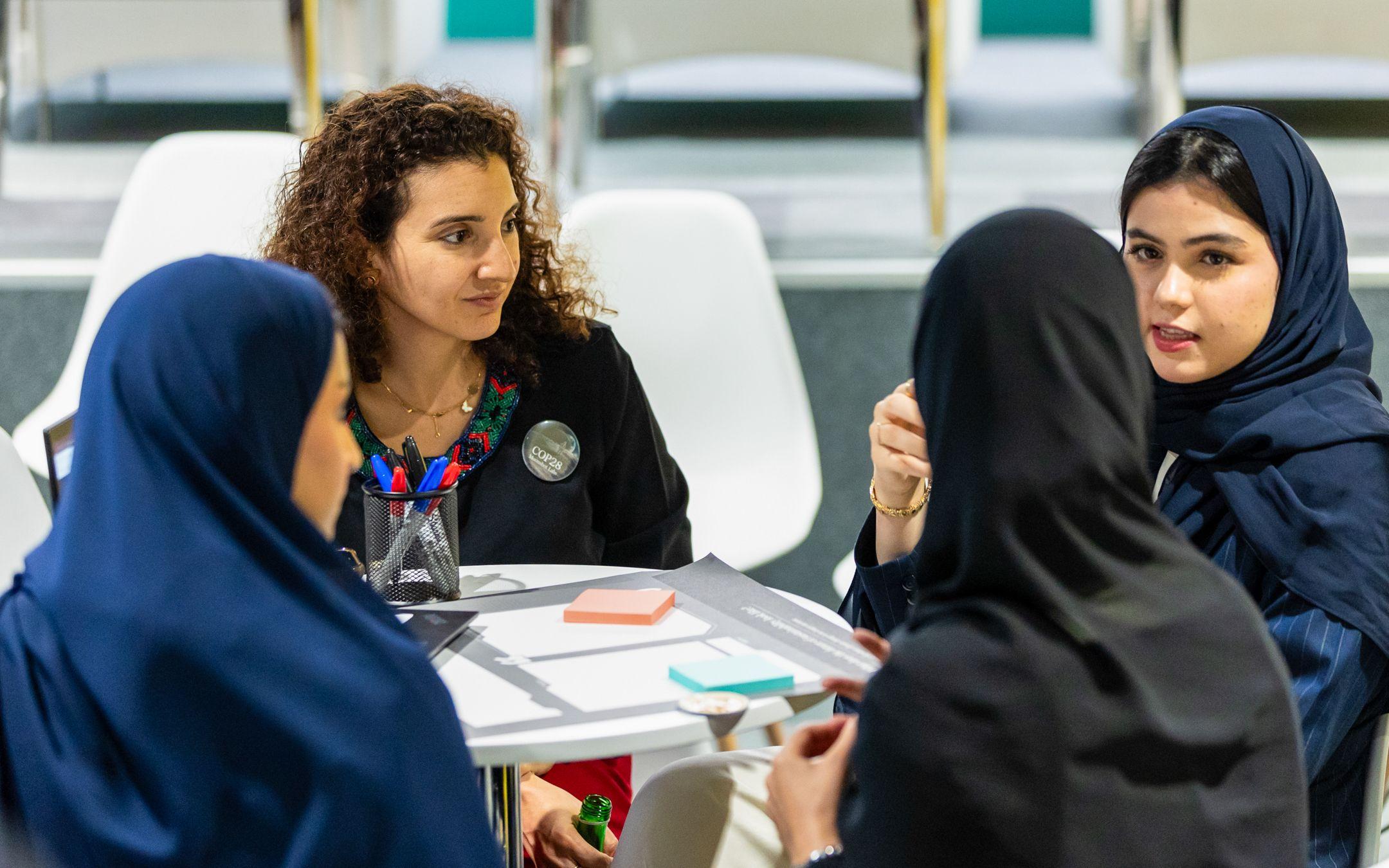 Zein Altawil of Yello discusses slow fashion and sustainable materials with a group of women.
Photo: Yello