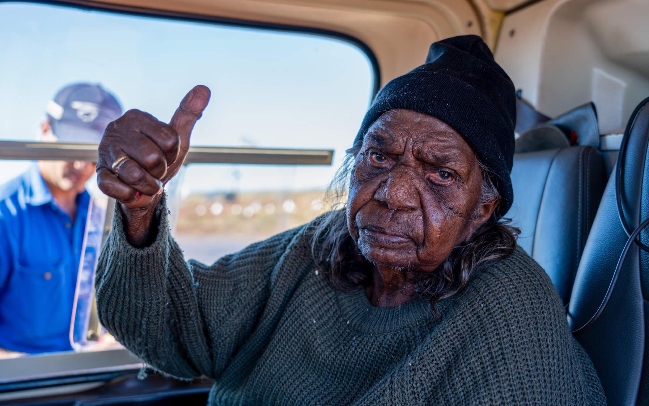 Pujiman (desert-born) Elder, Kumpaya Girgiba sits in the helicopter ready to direct the waterhole mapping flight through memory and traditional songs. 
Photo: Kanyirninpa Jukurrpa